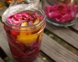 jar of rose petals, lemon, whiskey