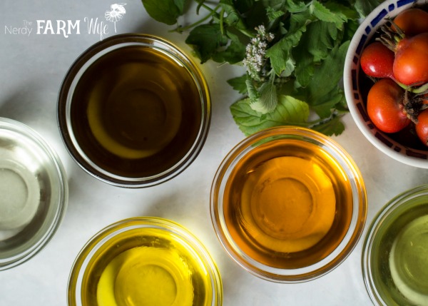 a variety of oils to make DIY Herbal Lip Balms