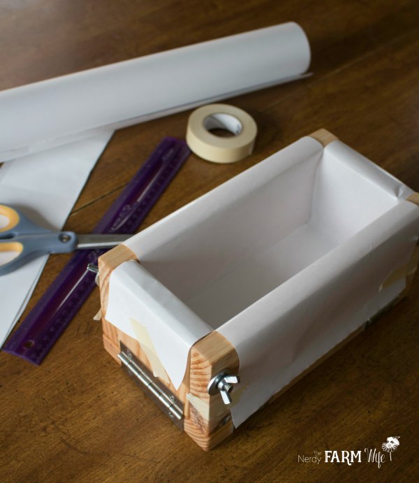 Wooden soap mold lined with freezer paper ready for cold process soap