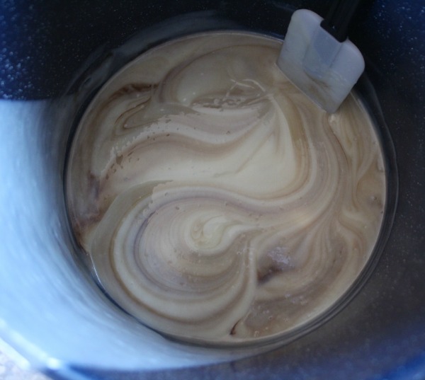 Mixing cocoa into milk soap batter