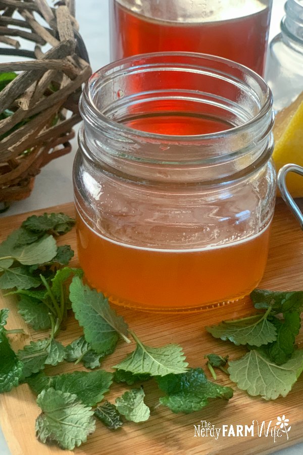 a jar of lemon balm syrup