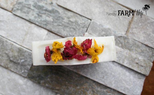 natural soap topped with dried forsythia and quince flowers