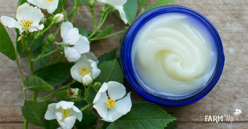 a blue glass jar of headache balm