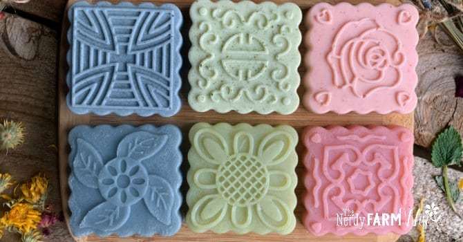 several square soaps with decorative tops