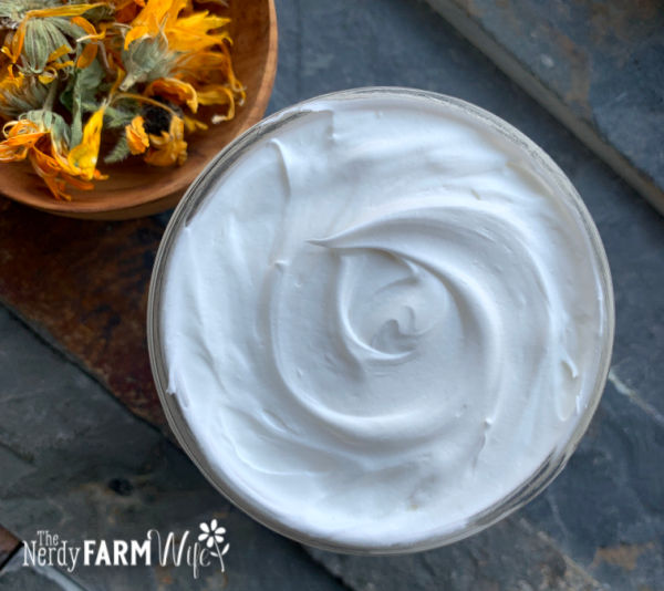 jar of whipped body butter with dried calendula flowers
