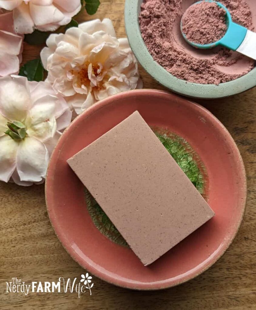a rose clay shower bar on a saucer