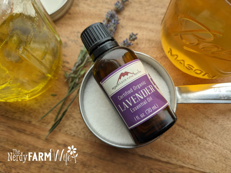 bottle of lavender essential oil with honey and sugar