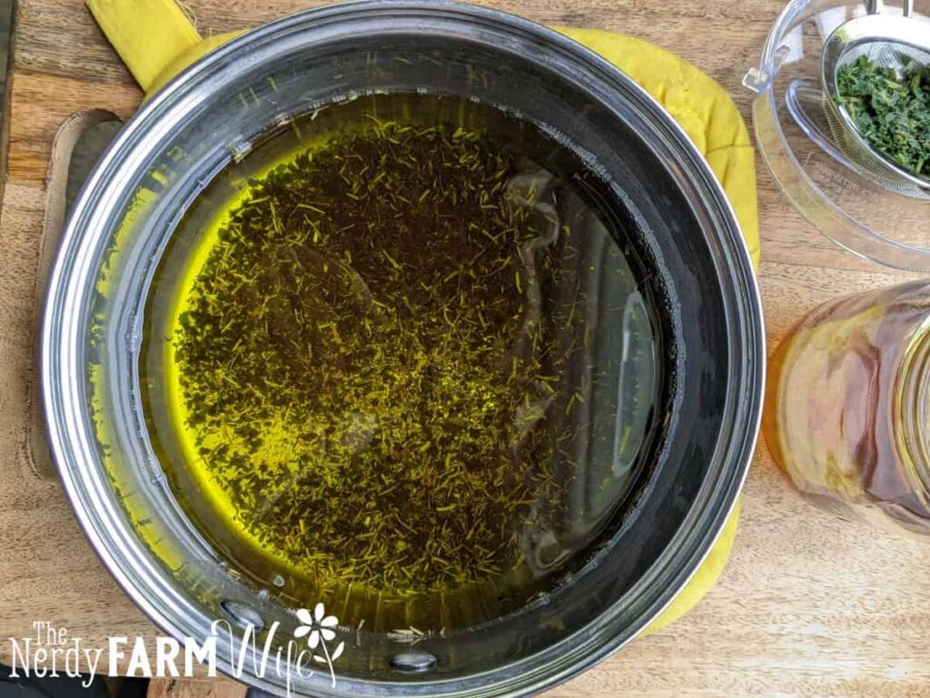 pot of oil with crumbled nettle